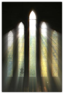 Sunlight streaming through stained glass windows